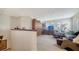 Inviting living room featuring plantation shutters and comfortable seating at 5356 Mang Pl # 1404, Sarasota, FL 34238