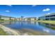 Beautiful community pond with a fountain and well-maintained landscaping at 5356 Mang Pl # 1404, Sarasota, FL 34238