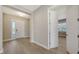 Inviting entryway with wood-look floors, and a view into another room at 10027 Cross River Trl, Parrish, FL 34219