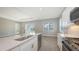 View of the kitchen featuring a quartz countertop island, recessed lighting and stainless steel appliances at 10027 Cross River Trl, Parrish, FL 34219