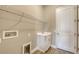 Utility room featuring sink, cabinet, metal shelving and utility connections for your appliances at 10027 Cross River Trl, Parrish, FL 34219
