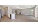 Spacious open floor plan features wood floors, recessed lighting, and seamless flow from kitchen to living room at 10027 Cross River Trl, Parrish, FL 34219