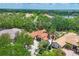 Expansive aerial view of a sprawling estate with lush greenery and tiled roofs at 11551 30Th E Cv, Parrish, FL 34219