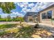 Outdoor patio with a screened-in pool area, stone walkway, and lush landscaping for a serene retreat at 11551 30Th E Cv, Parrish, FL 34219