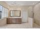 Elegant bathroom featuring a double vanity, walk-in shower, and chic lighting fixtures at 11551 30Th E Cv, Parrish, FL 34219