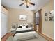 Comfortable bedroom with wood floors, soft lighting, and tasteful decor that create a relaxing atmosphere at 11551 30Th E Cv, Parrish, FL 34219