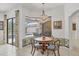 Bright breakfast nook featuring decorative tile work and a view of the beautiful outdoor pool area at 11551 30Th E Cv, Parrish, FL 34219
