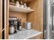 Kitchenette area with a coffee maker, toaster, and a stainless steel refrigerator at 11551 30Th E Cv, Parrish, FL 34219