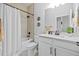 Contemporary bathroom featuring a shower-tub combination and white vanity with dark fixtures at 11719 Chevelon Ln, Parrish, FL 34219