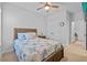 Inviting bedroom featuring a ceiling fan, double closet, and view to another room at 11719 Chevelon Ln, Parrish, FL 34219