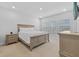 A serene bedroom with neutral tones, large bed, and ample natural light at 11719 Chevelon Ln, Parrish, FL 34219