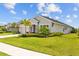 Well-maintained single-story home featuring a manicured lawn and a two-car garage at 11719 Chevelon Ln, Parrish, FL 34219