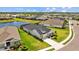 New construction with a manicured lawn and a lake in the backyard at 11719 Chevelon Ln, Parrish, FL 34219