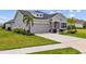 Beautiful single-story home with well-manicured lawn and an attached two-car garage at 11719 Chevelon Ln, Parrish, FL 34219