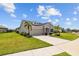 Beautiful single-story home with well-manicured lawn and an attached two-car garage at 11719 Chevelon Ln, Parrish, FL 34219