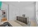 Well-lit home office with a double closet, a large desk, and a gray accent rug at 11719 Chevelon Ln, Parrish, FL 34219