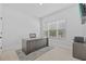 Clean, bright home office with a large desk, neutral colors, and a view from the window at 11719 Chevelon Ln, Parrish, FL 34219
