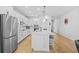 Bright kitchen with stainless appliances, white cabinets, and large island at 11719 Chevelon Ln, Parrish, FL 34219