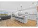 Spacious white kitchen with large island and seating at 11719 Chevelon Ln, Parrish, FL 34219