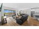 Open-concept living area with sliding glass doors leading to an outdoor space with water view at 11719 Chevelon Ln, Parrish, FL 34219
