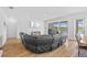 Open-concept living room with large sectional couch at 11719 Chevelon Ln, Parrish, FL 34219