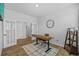 Bright office with French doors, wood desk, and decor at 11719 Chevelon Ln, Parrish, FL 34219