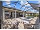 Inviting screened-in patio with seating overlooking a tranquil pool and spa at 11719 Chevelon Ln, Parrish, FL 34219