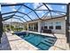 Beautiful screened-in pool and spa with covered patio for year-round relaxation at 11719 Chevelon Ln, Parrish, FL 34219