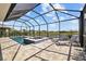 Relaxing screened-in pool area with spa and lounge chairs, perfect for outdoor enjoyment at 11719 Chevelon Ln, Parrish, FL 34219