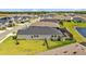 Aerial view of house featuring screened-in pool and fenced yard at 11719 Chevelon Ln, Parrish, FL 34219