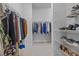 Spacious walk-in closet features ample storage with shelving and hanging space for clothes and shoes at 11719 Chevelon Ln, Parrish, FL 34219