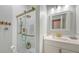 Bright bathroom with glass shower, quartz counters and bronze fixtures at 13130 50Th E Ct, Parrish, FL 34219