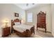Charming bedroom with wooden furnishings, decorative lamp, and cozy ambiance at 13130 50Th E Ct, Parrish, FL 34219