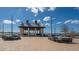 Community venue with outdoor seating offering lake views and social gathering spaces at 13130 50Th E Ct, Parrish, FL 34219