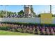Entrance sign to Shoppes at UTC with manicured landscaping and vibrant flowers at 13130 50Th E Ct, Parrish, FL 34219
