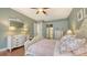 Bright main bedroom with hardwood floors, creating a calming retreat for relaxation and restful nights at 13130 50Th E Ct, Parrish, FL 34219