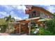 Exterior of a miniature golf course with rustic wood design and lush landscaping at 13130 50Th E Ct, Parrish, FL 34219