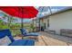 An outdoor patio space with comfortable seating and a barbecue grill offers an area for relaxation and outdoor dining at 13130 50Th E Ct, Parrish, FL 34219