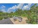 Relaxing backyard patio with outdoor seating and a garden view, offering an inviting outdoor retreat at 13130 50Th E Ct, Parrish, FL 34219