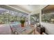 Covered patio with outdoor dining, overlooking a pool and landscaped backyard at 13130 50Th E Ct, Parrish, FL 34219