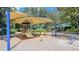 Colorful playground with slide and covered area in the community at 13130 50Th E Ct, Parrish, FL 34219