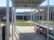 Exterior view of Annie Lucy Williams Elementary School with covered walkway and benches at 13130 50Th E Ct, Parrish, FL 34219