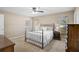 Neutral bedroom with a bed, large windows, and coordinated furniture at 13612 11Th E Ter, Bradenton, FL 34212