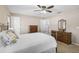 Bright bedroom with a large bed and views of an ensuite bathroom at 13612 11Th E Ter, Bradenton, FL 34212