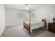 Bright bedroom features carpet flooring, a ceiling fan, plantation shutters, and neutral colored walls at 13612 11Th E Ter, Bradenton, FL 34212