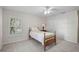 Cozy bedroom with carpet flooring, ceiling fan, plantation shutters, and a closet for storage at 13612 11Th E Ter, Bradenton, FL 34212