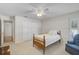 Bedroom with carpet flooring, ceiling fan and a double door closet at 13612 11Th E Ter, Bradenton, FL 34212