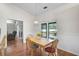 Bright dining area with wood floors and adjacent living area at 13612 11Th E Ter, Bradenton, FL 34212