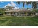 Charming single-story home with a well-manicured lawn, inviting front porch, and classic shutters at 13612 11Th E Ter, Bradenton, FL 34212