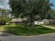 Beautiful single-story home boasting lush greenery, mature shade trees, and a long driveway at 13612 11Th E Ter, Bradenton, FL 34212